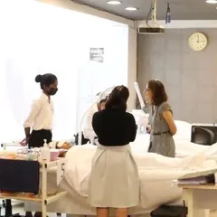 A glimpse into our CIBTAC examination process. Students perform advanced facial treatments on live models under the supervision of international examiners, ensuring they meet global standards.