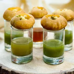 Pani Puri, Golgappa, or Puchka, whatever you call it, the love is universal. I serve them in shot glasses for a modern, hygienic presentation that's perfect for weddings and large gatherings.