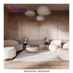 This living space showcases our expertise in creating ultra-modern and sculptural furniture. The curved white sofa and matching armchairs are custom-designed to create a soft, inviting, and sophisticated seating area. This is an example of how we can tailor unique silhouettes to fit a specific design vision.