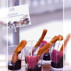 A close-up of our Churros with Chocolate, a simple yet irresistible dessert. We also offer fresh strawberries for dipping, adding a fruity twist to this classic treat.