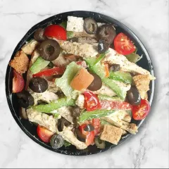 A top-down view of our chicken salad, generously filled with grilled chicken strips, cherry tomatoes, bell peppers, and olives. This shows the rich texture and vibrant colors of our freshly prepared salads.