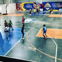 Players spread out during a fast-paced game. The clear markings for the key and three-point line make our court ideal for structured basketball play.