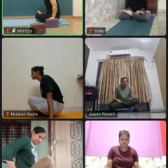 Students from different locations join my online class. Here, they are practicing a seated pose, using blocks for support to maintain a straight spine.