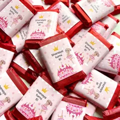 Mini chocolate bars with custom wrappers for little Shanaya's 6th birthday party, featuring a cute princess and castle theme.