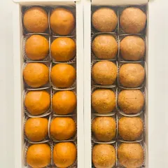 A side-by-side comparison of our Besan Laddoos and Atta Panjiri Laddoos. Both are made with desi ghee and are a staple for festive celebrations and gifting.