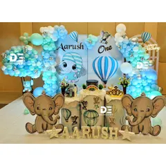 A full view of an adorable baby elephant theme, one of my most popular choices for a boy's first birthday. I combine cute character cutouts, cloud-like balloon arrangements, and personalized name displays for a dreamy sky-high adventure.