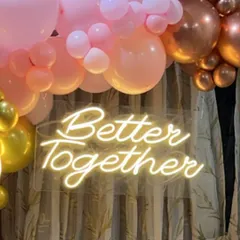A close-up of the custom neon sign, which can be personalized with any message or name for your event.