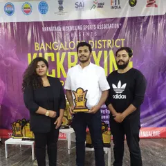 Receiving a token of appreciation for judging at the Bangalore District Kickboxing Championship. I enjoy sharing my knowledge and experience with the next generation.