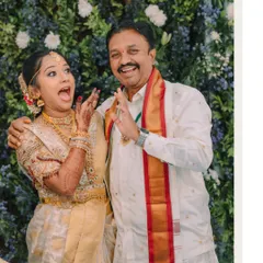 A fun and candid moment between the bride and her father, their playful expressions showing a lifetime of love and laughter.