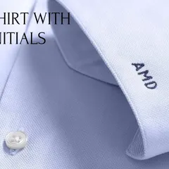 Personalize your handcrafted shirt with custom monogramming. This close-up shows initials embroidered on the cuff, a small detail that adds a significant touch of personal style to your business attire.