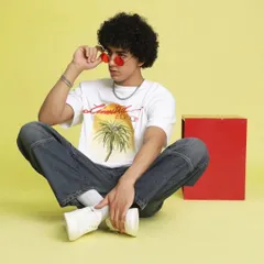 Here, I styled a casual, summery look with a graphic tee and relaxed-fit jeans against a bright yellow backdrop. The red-tinted glasses add a pop of color and personality, perfect for a youthful brand.