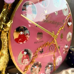 A side view of the custom baby clock, showing the glossy finish and the depth of the resin. The gold details and butterfly accents add a touch of magic.