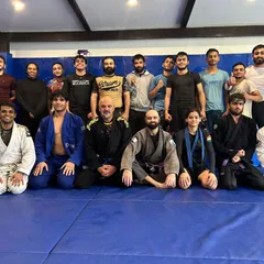The crew after our year-end open mat. It's great to see everyone in their gis, celebrating promotions and a year of hard work.