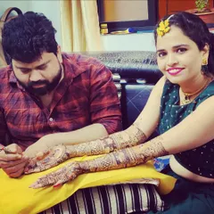 A happy client showing off her full-arm mehndi during what looks like her Haldi ceremony. Seeing my clients smile is the best part of my job.