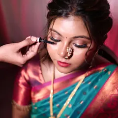 This is what I mean by makeup that enhances, not changes. A behind-the-scenes shot of me applying mascara to complete this beautiful, natural bridal look.