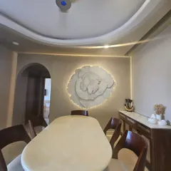 This large scale 3D floral installation became the heart of our client's dining room. Weighing over 40 kgs, this textured wall art piece shows how we can transform a simple wall into a dramatic and elegant statement, complete with custom backlighting.