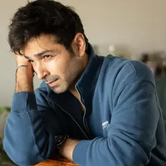 A pensive moment from the same session with Varun Mitra. The natural light and simple setting keep the focus entirely on his expression.