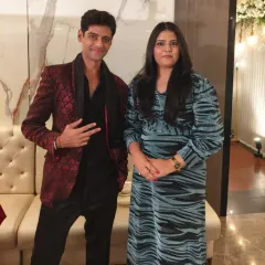 Posing with a fan after a successful anchoring event in Vashi. I always make time to connect with audience members who appreciate my work.