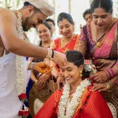The tying of the Mangalyam is a pivotal moment. I captured the groom's gentle focus and the bride's happy smile, a beautiful exchange that marks the beginning of their marriage.