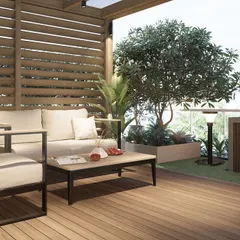 Comfort is key. Here you can see the detailed design of the seating area under the pergola, complete with a slatted wooden screen for privacy and shade, surrounded by carefully selected potted plants.