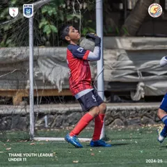Our U11 keeper confidently claims the ball, showcasing strong fundamentals.