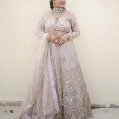 A simple and elegant full-length shot, perfect for showing how the lehenga looks in natural light.