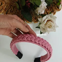 This baby pink macrame hairband is one of my bestsellers. The four-strand braid pattern gives it a lovely texture, and it's a perfect accessory for both casual and festive looks.