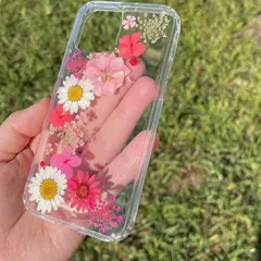 Protect your phone with a personal touch. This custom floral phone case is made with real, carefully placed pressed flowers, all sealed in crystal-clear resin. You can choose the flowers and layout to match your style perfectly.