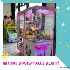 A look at our arcade adventures, featuring a claw machine full of prizes and a Mickey Mouse themed basketball game.