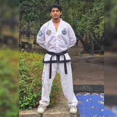 In my full Taekwondo uniform, ready to teach. I lead by example, embodying the discipline and respect that I expect from all my students.