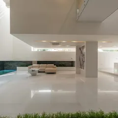 The guest level of the neeti residence, where the living space opens directly to an indoor pool, blurring the line between inside and out…