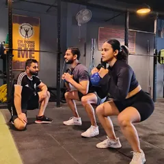 A Monday session sets the tone for the week. Here I am checking the form on a kettlebell goblet squat, ensuring depth and posture are correct. We believe in starting the week strong, together.