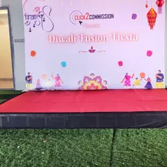 A custom-branded photo backdrop and stage for the "Diwali Fusion Fiesta". This creates a perfect spot for team photos and performances.