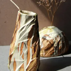 These two Kurinuki vases were an exploration of the technique. I carved and chiseled the clay to create facades that resemble a cut-down mountain, resulting in unique statement pieces for any space.