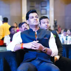 Capturing a candid moment of Dr. Shrikant Shinde during an event. My political and corporate event photography focuses on documenting key figures and attendees in a professional and unobtrusive manner.