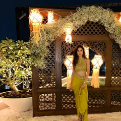Pre-gig shot in a stunning lime green outfit for a Diwali party. I love bringing firecracker energy to festive events.