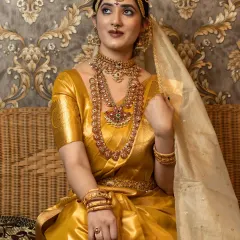 This full-length shot from a student's portfolio showcases the complete bridal look, including the elegant saree drape and posture.