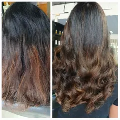 A common issue is old color that has turned brassy and orange. Here, I corrected the tone and blended the regrowth area into a soft, natural-looking balayage, finishing with waves to show off the new dimension.