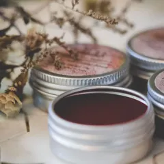 My natural lip and cheek tints, available in three beautiful shades. The deep red tint in the foreground is perfect for a bold look, while the others offer a softer touch of color.