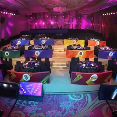 The team tables at the PKL auction, each with custom branding. We manage the entire room layout, ensuring each franchise has a fully equipped and branded station for the high-stakes bidding process.