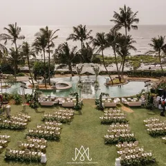 I love crafting breathtaking outdoor weddings. Here, I designed an elegant seaside ceremony with a stunning mandap built over the pool, creating a serene and luxurious atmosphere against the ocean backdrop.