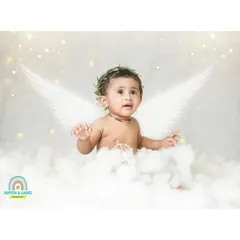 A baby is as pure as an angel. We added wings to this little one sitting on a cloud for a heavenly and beautiful portrait.