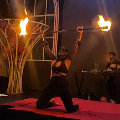A moment of power and focus during a fire staff performance. This shot captures the intensity and artistry I bring to the stage, creating a dramatic centerpiece for any event.