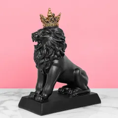 This roaring black lion with a golden crown is a powerful and regal showpiece. The contrast between the matte black and the shiny gold creates a dramatic and luxurious look.