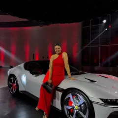 Dressed in red for the exclusive launch of the Ferrari 12Cilindri. This one-shoulder gown creates a bold, statuesque silhouette that matches the power and elegance of the event. Styling for a luxury brand launch requires a look that is both sophisticated and high-impact.