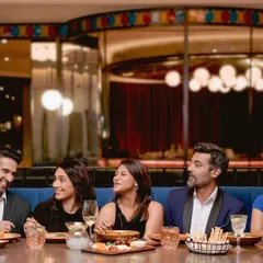 We created this modern interpretation of 'The Last Supper' for a hotel shoot, going beyond the original brief. This image demonstrates my skill in directing a large group of actors to create a specific, complex mood. It highlights my experience in conceptual photography and managing a full production team, including stylists and set designers.