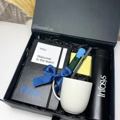 A sleek and professional welcome kit for Infosys. The all-black theme includes a branded notebook, bottle, and mug, creating a cohesive and impressive first impression for new team members.