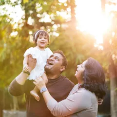 What a beautiful way to celebrate a first birthday. This outdoor family session is filled with laughter and joy, capturing the loving moments between parents and their one-year-old.