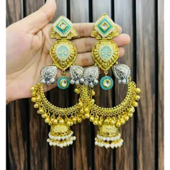 Unique and artistic statement earrings combining gold, silver, and turquoise elements with jhumka drops. These are for someone who loves to stand out.