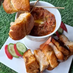 A unique twist on a classic street food, my Fondue Pav Bhaji is a party favourite. Served with toasted pav pieces for dipping, it's both fun and delicious.